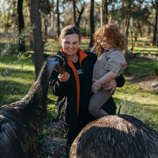 Mother & Daughter feeding Emu at Australian Wildlife Sanctuary